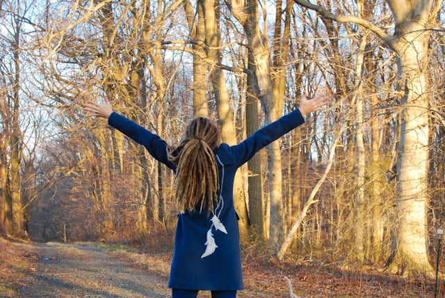 Women with back to camera wearing layers