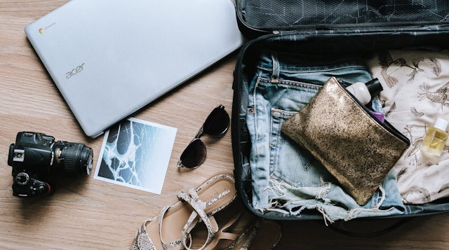 Open suitcase and gadgets