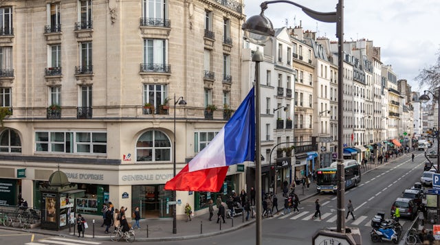 Street corner in Bastille with French flag waving