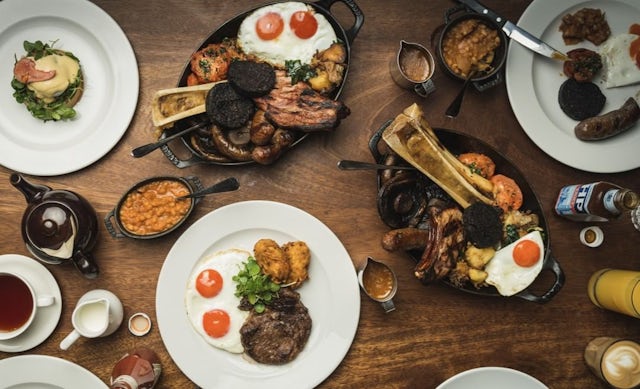 Plates of food at Hawksmoor Guilhall, London