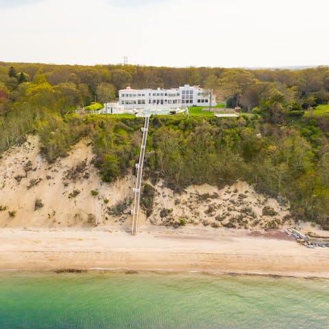 Take the steps down to the private beach and swim in the Long Island Sound