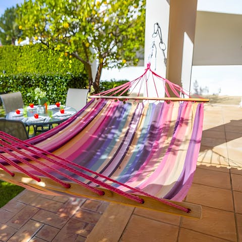 Lie back and relax with a good book in the hammock