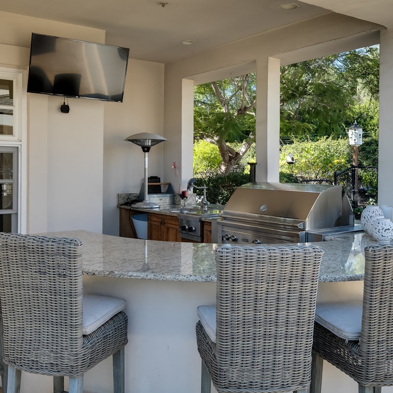 Mix up some cocktails at the bar and outdoor kitchen area