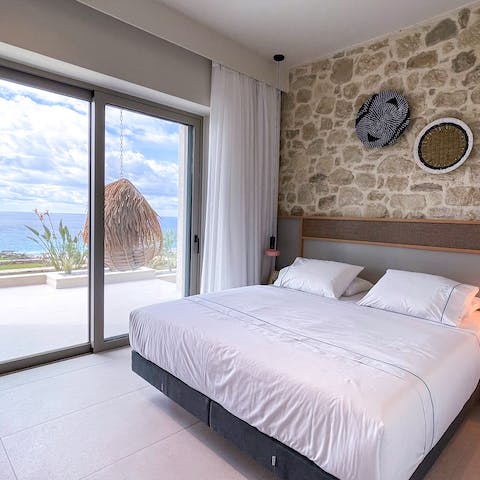 Wake up to dazzling views of the Ionian Sea from the bedroom every morning