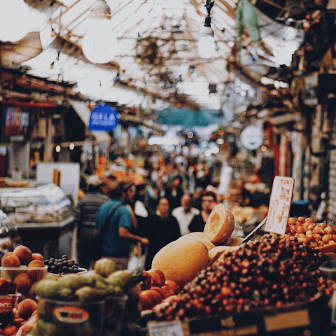 Sample fresh produce at Mahane Yehuda Market, a five-minute journey from home