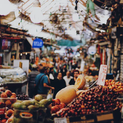 Sample fresh produce at Mahane Yehuda Market, a five-minute journey from home