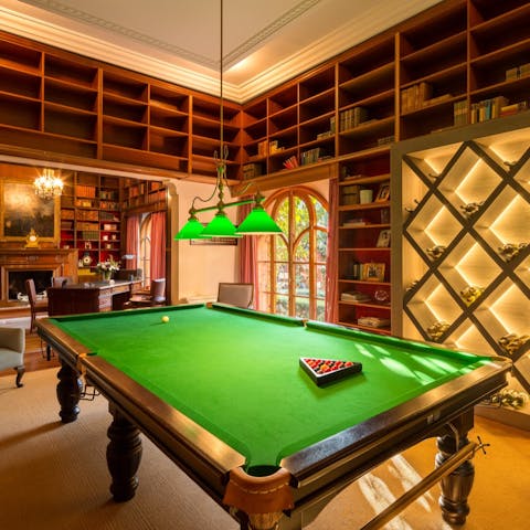 Play a game or three of pool in the atmospheric billiards room