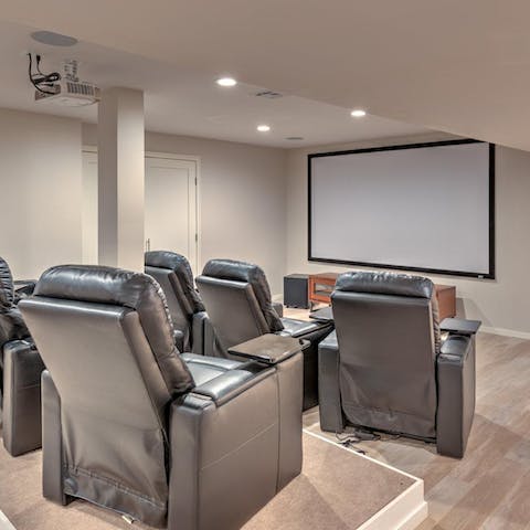 Set up a film in the state-of-the-art cinema room with recliners