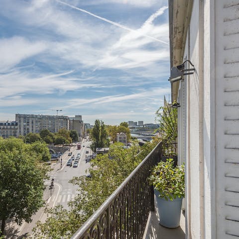 Admire sensational views of the Seine from the Haussmannian balcony