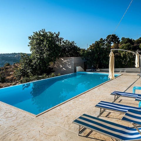Soak up the sun by the private pool and take in the views 