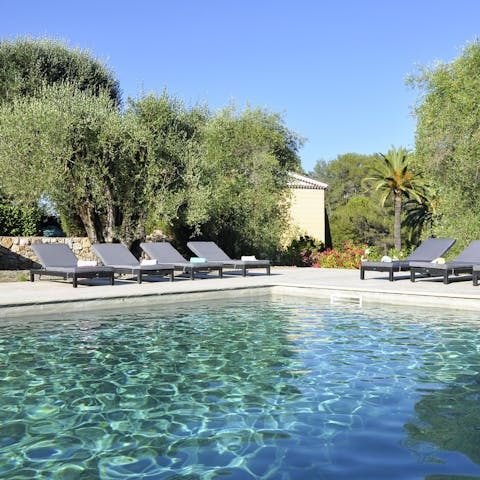 Cool off in the crystalline waters of the outdoor pool