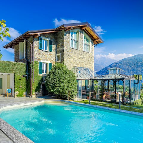 Splash the day away in the sparkling pool with Lake Como as your backdrop