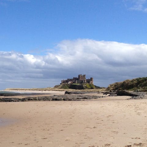 Get your toes in the sand at Bamburgh Beach, just over half a mile from home