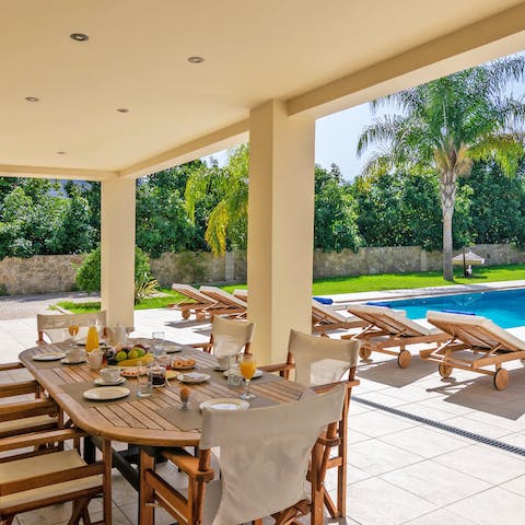 Gather for Cretan-inspired meals with relaxing views across the garden
