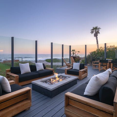 Find the perfect spot for sunset drinks by the fire pit 