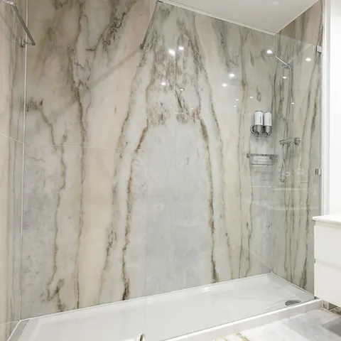 Start mornings off with a relaxing soak in the stunning marble shower