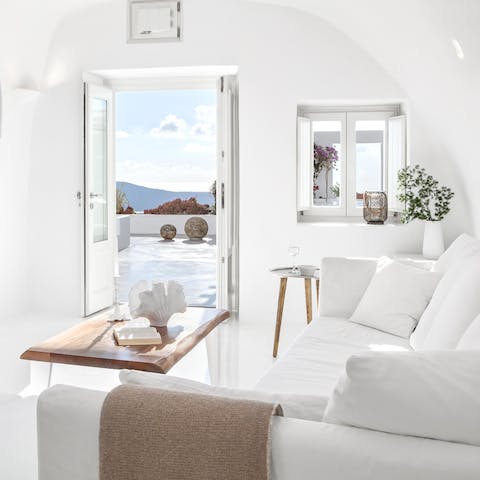 Stay in a gorgeous traditional cave villa decorated in soothing white tones