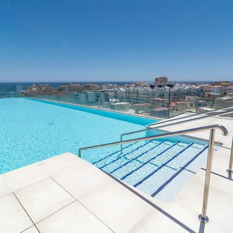 Soak up the picturesque views from the shared rooftop swimming pool