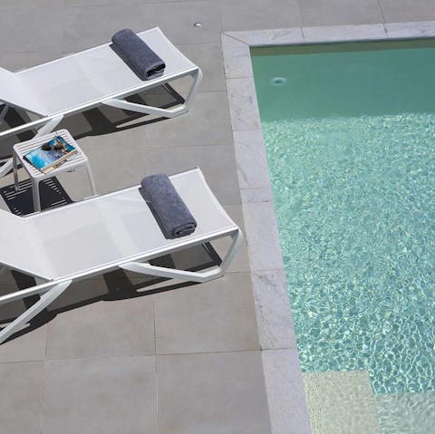 Lounge by the pool on sunny afternoons or just float the day away in the blue water