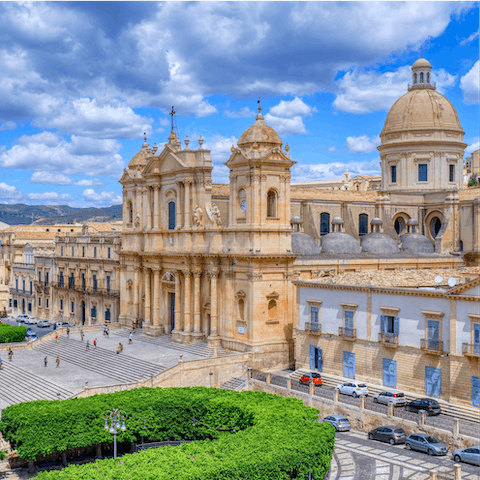 Admire the Baroque architecture at Noto Cathedral, a short drive away