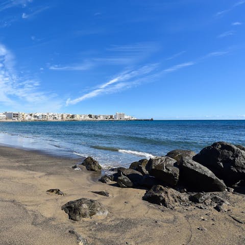 Soak up the sunshine at Playa del Cabrón, a ten-minute drive away