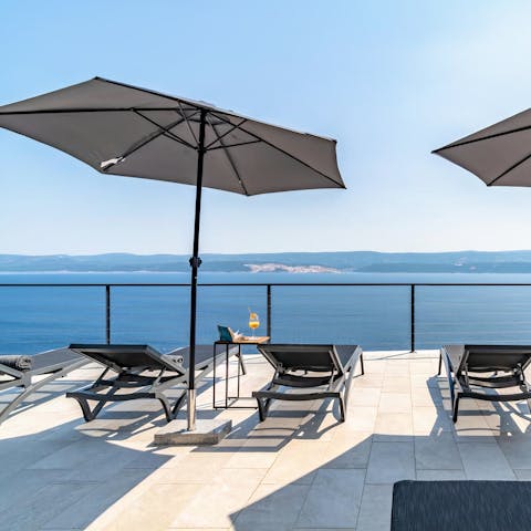 Take in the incredible sea views from the terrace and balconies