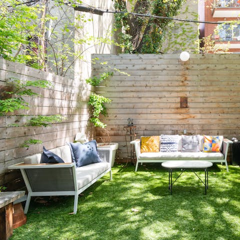 Spend summer days relaxing in the sun-dappled back garden