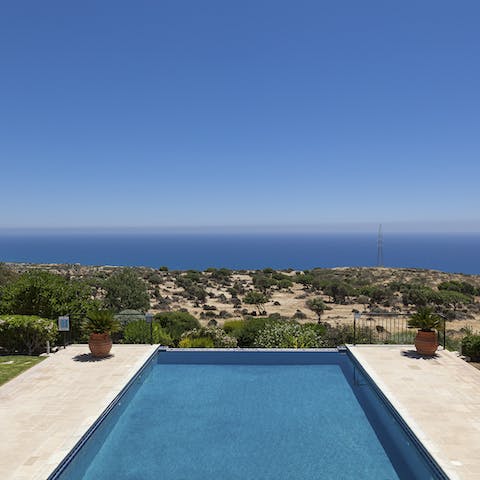 Dive into the pristine waters of your pool overlooking the Mediterranean