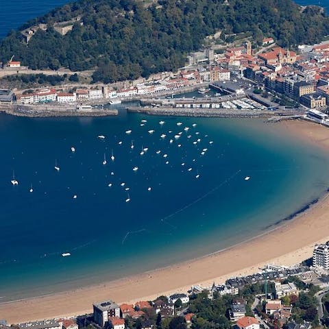 Enjoy leisurely watching the boats around La Concha beach