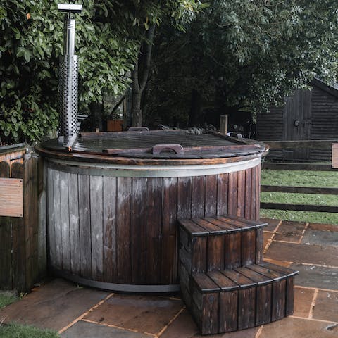 Look up at the twinkling stars from the outdoor wood-fired hot tub