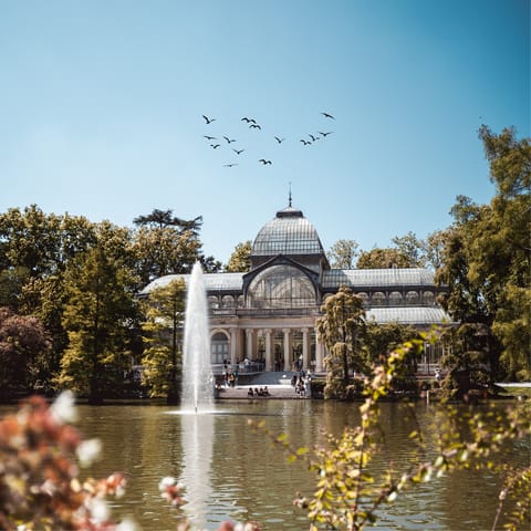 Grab a coffee to go and head for El Retiro Park, just a forty-minute stroll away
