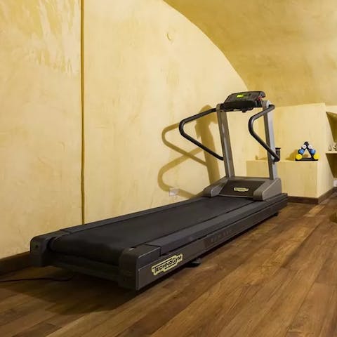 Break a sweat in the small fitness room, with a treadmill and hand weights