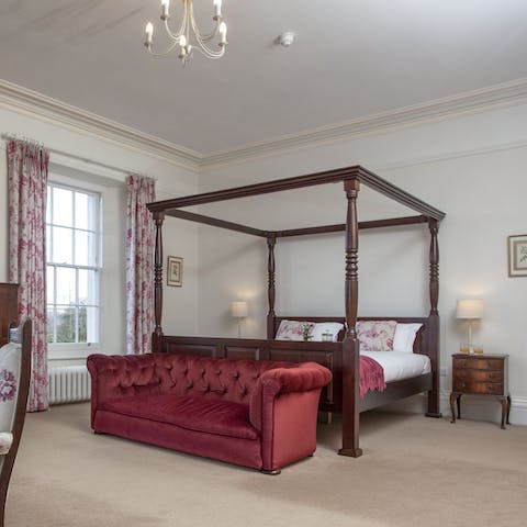 Drift off in the comfort of your lavish four-poster bed