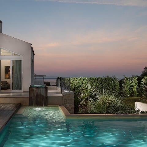 Indulge in a sunset swim in your private swimming pool