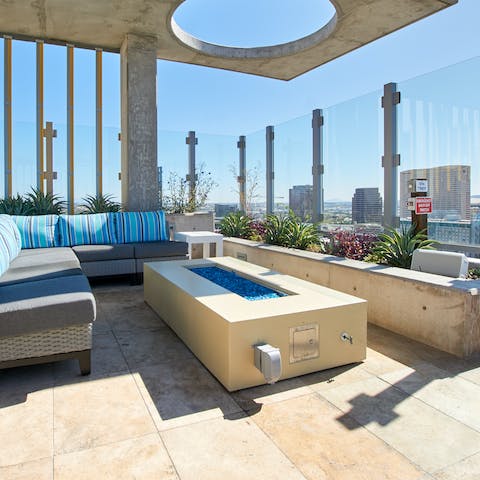 Enjoy evening cocktails by the fire pit with views over Downtown Phoenix