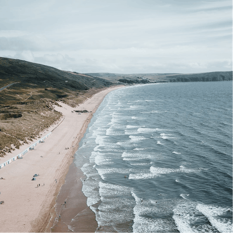 Stretch out on the sands of Woolacombe Beach, a five-minute drive away