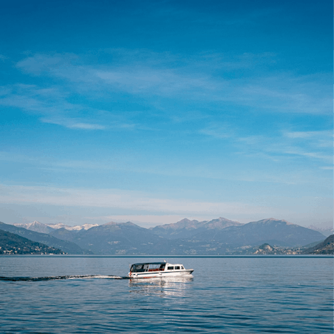 Rent a boat to enjoy the surrounding scenery from Lake Como