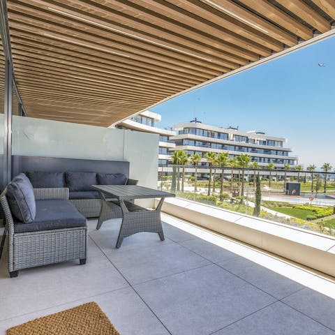 Sip cocktails on the balcony while drinking in sea views