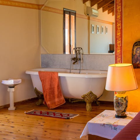 Take a long soak in the freestanding bathtub