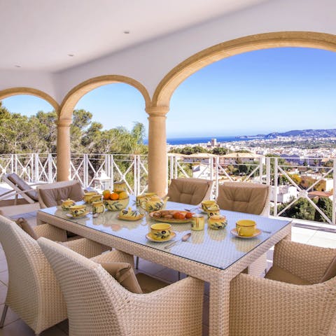 Dine alfresco on arroz a banda while enjoying the sea view