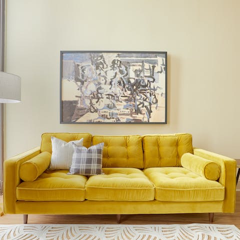 Recline on the sunshine yellow sofa with a hot coffee in the mornings