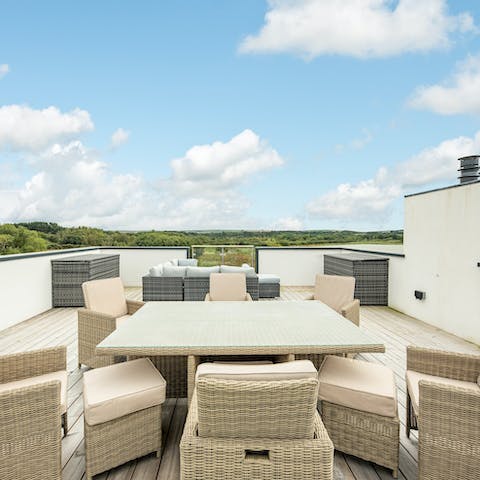 Toast the day's end from the lodge's magnificent rooftop terrace