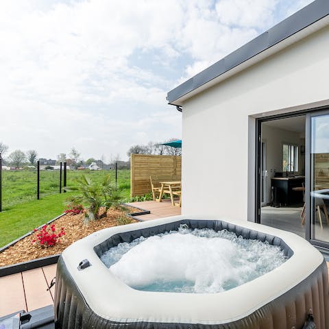 Sink into the bubbling hot tub under the starry sky