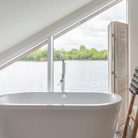 Take in the beautiful water views from the tub in the master bathroom