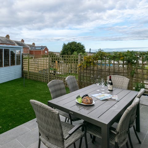Enjoy a glass of wine at garden's serene dining area