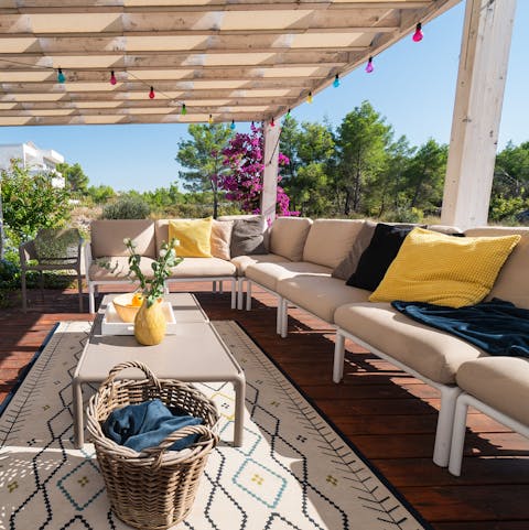 Sip cocktails in the shade of the pergola