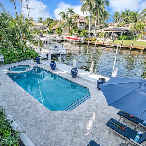 Go for a dip in the private swimming pool overlooking the dock