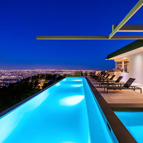 Enjoy a late night dip in the swimming pool as LA glitters in the distance