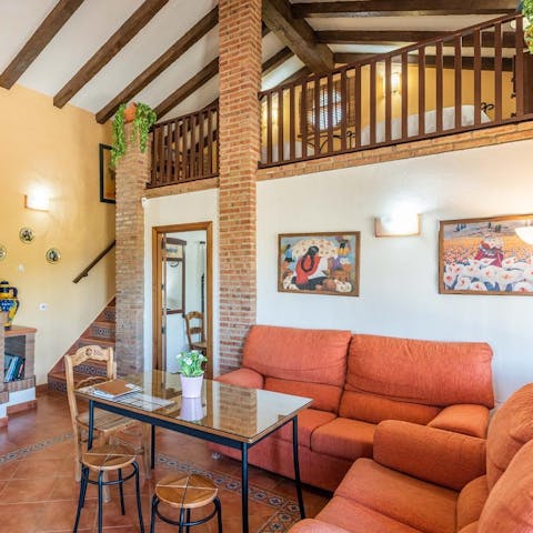 Chill out in the beamed living area with a glass of Spanish wine and a board game