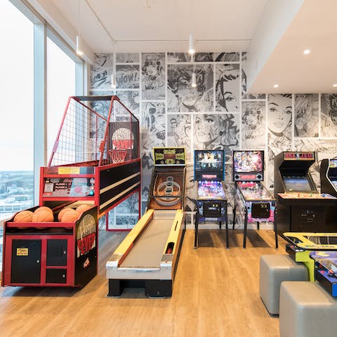 Unwind with a classic arcade game in the communal entertainment room
